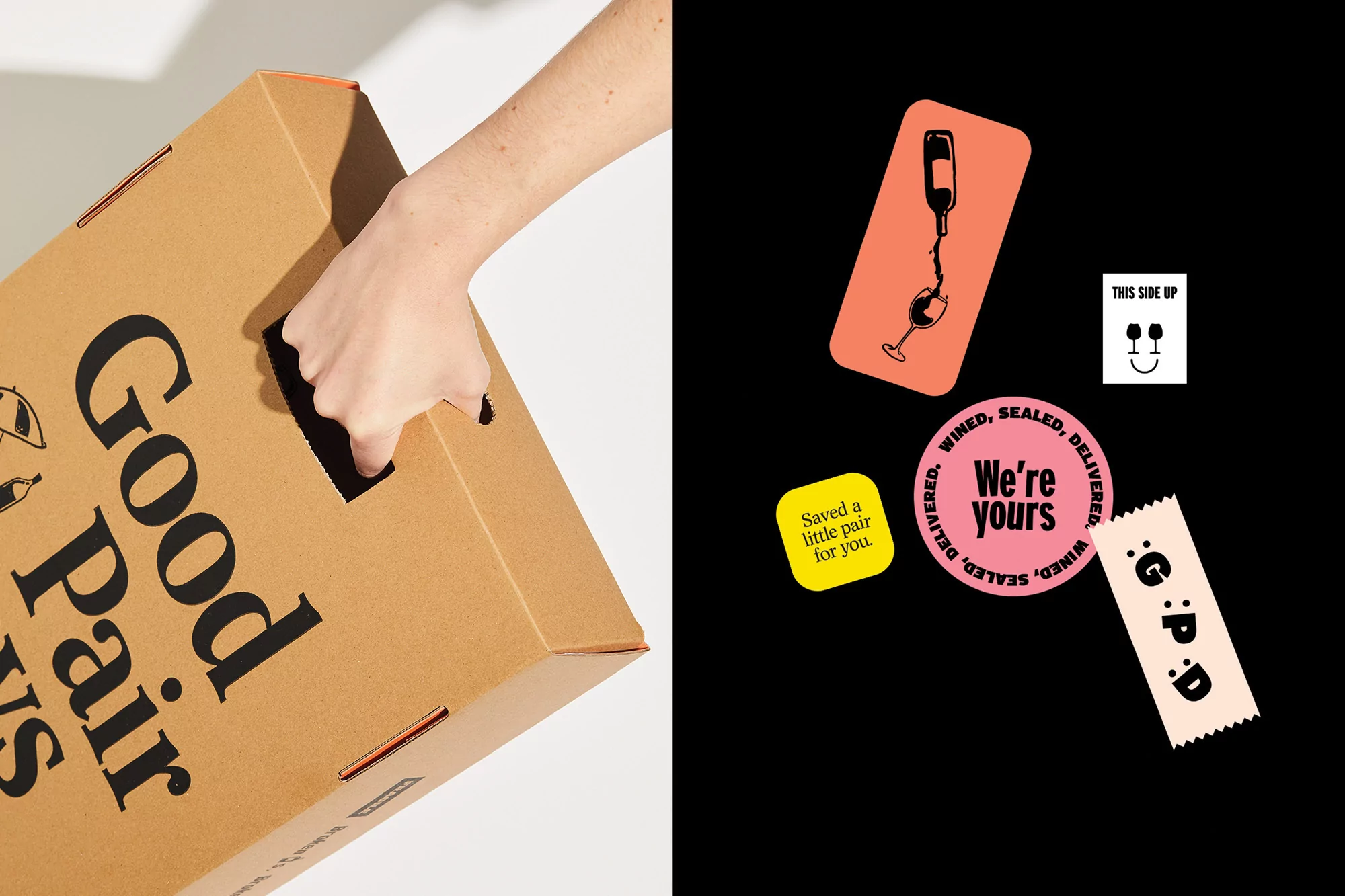 Hand grips handle of a branded cardboard delivery box; sticker graphics feature stylized bottle, wineglass, and cheerful typography.
