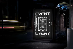 Illuminated bus stop poster displaying a bold typographic layout with the word EVENT repeating in a tunnel perspective.