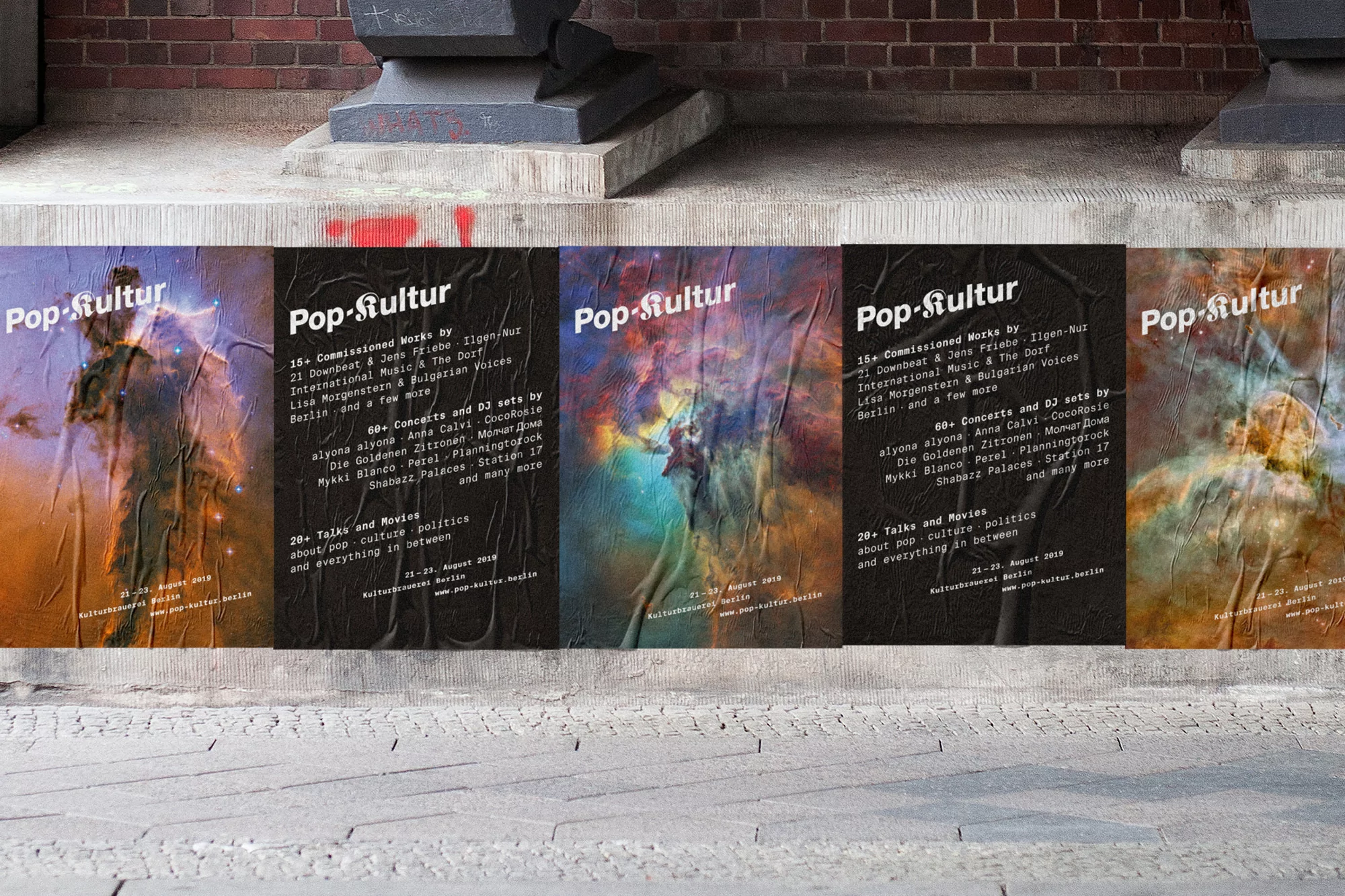 Street posters for 'Pop-Kultur' event, featuring abstract art, dark backgrounds, and event details in contrasting white text on a brick wall.