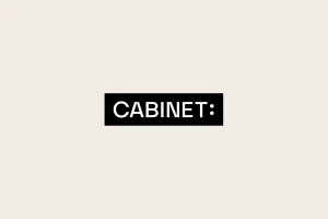 Cabinet brand identity logo in white uppercase text centered inside a solid black rectangle on a cream background.