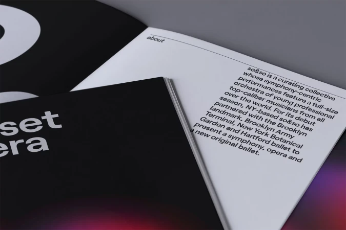 Open book featuring an artistic project or publication with the words 'sunset era' on the black cover and white text on the inner pages.