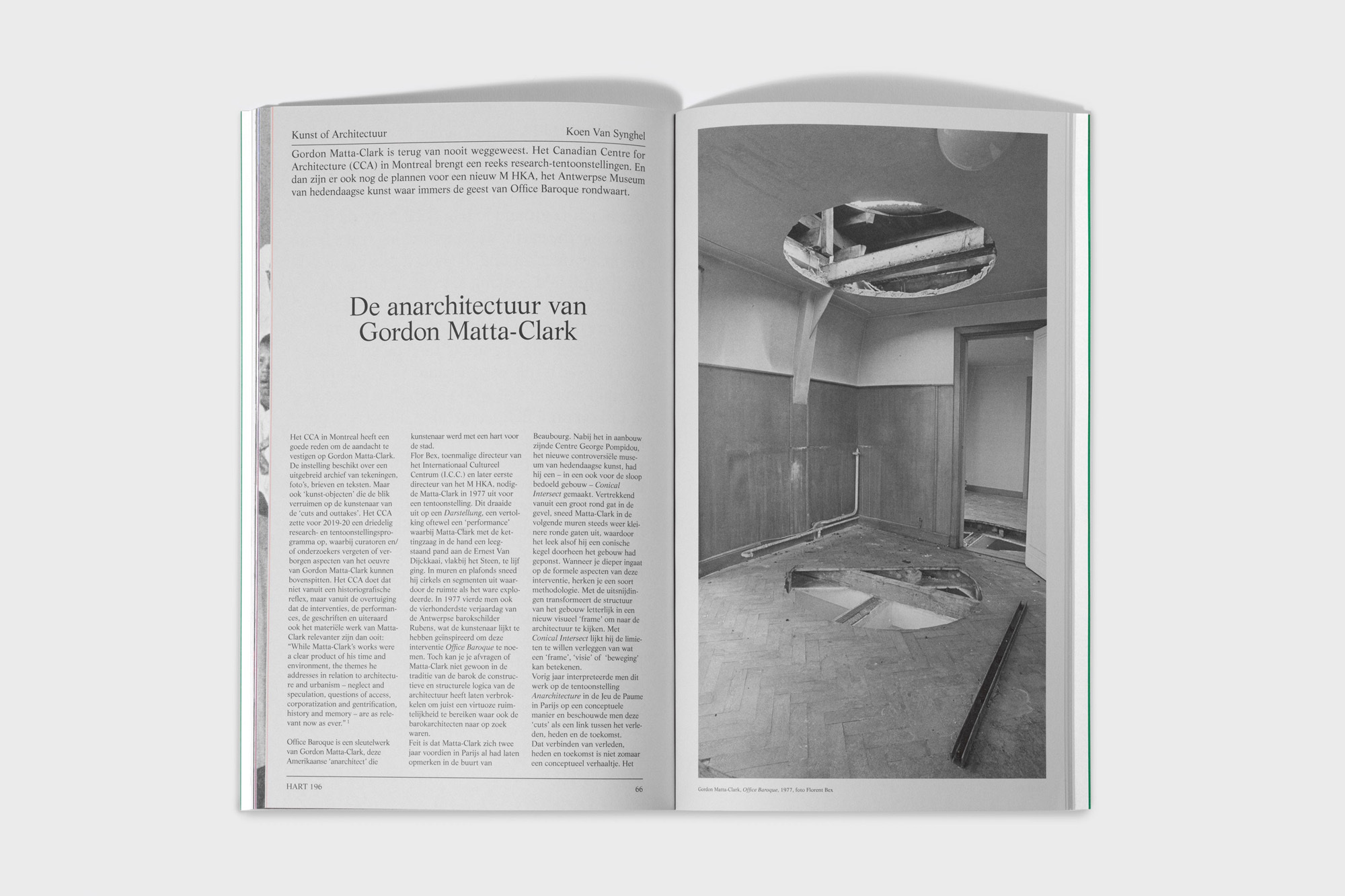 A black and white open book spread showcases an image of an interior under construction with exposed beams and damaged ceilings and floors.