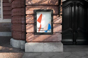 Impira brand identity poster featuring abstract shapes and typography mounted on a brick exterior wall
