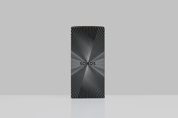 Sonos product box featuring a black background and an abstract radial design with thin white lines converging toward the center.