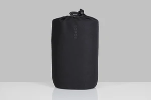 Black fabric Sonos speaker bag cinched at the top with a round product tag against a light grey studio background.