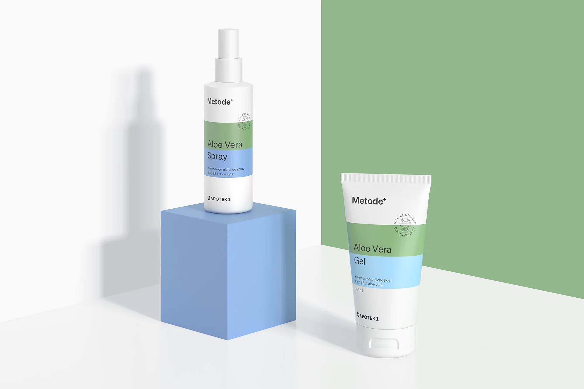 Aloe vera skincare products displayed on blue block against green and white backdrop featuring a bottle and tube.
