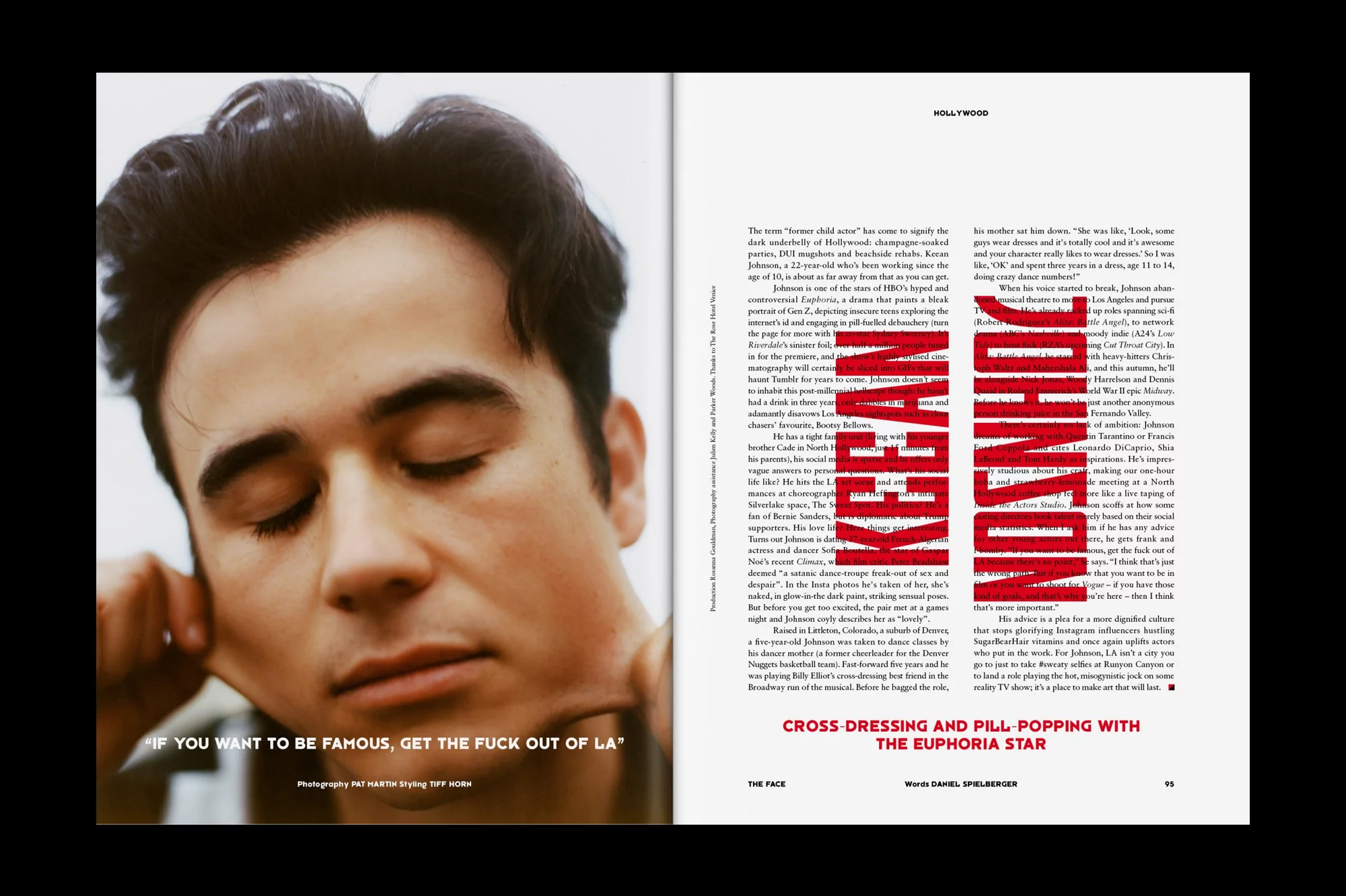 Close-up studio shot of a young adult male with dark hair and closed eyes, set against a magazine page featuring bold text, in a contemporary style.