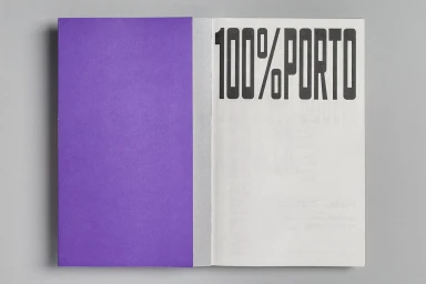 Open brochure with a solid purple left cover and bold black 100 percent porto typography on the right page against a grey background.