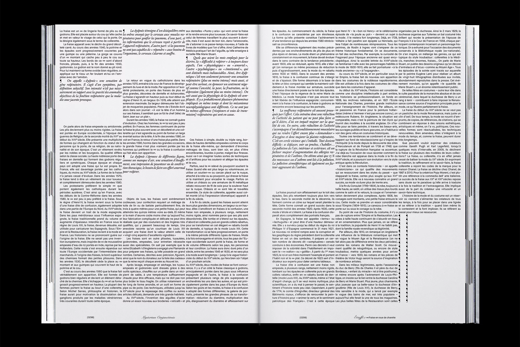 Open book displays text on both pages, illuminated against a dark background, showcasing book design and typography elements.