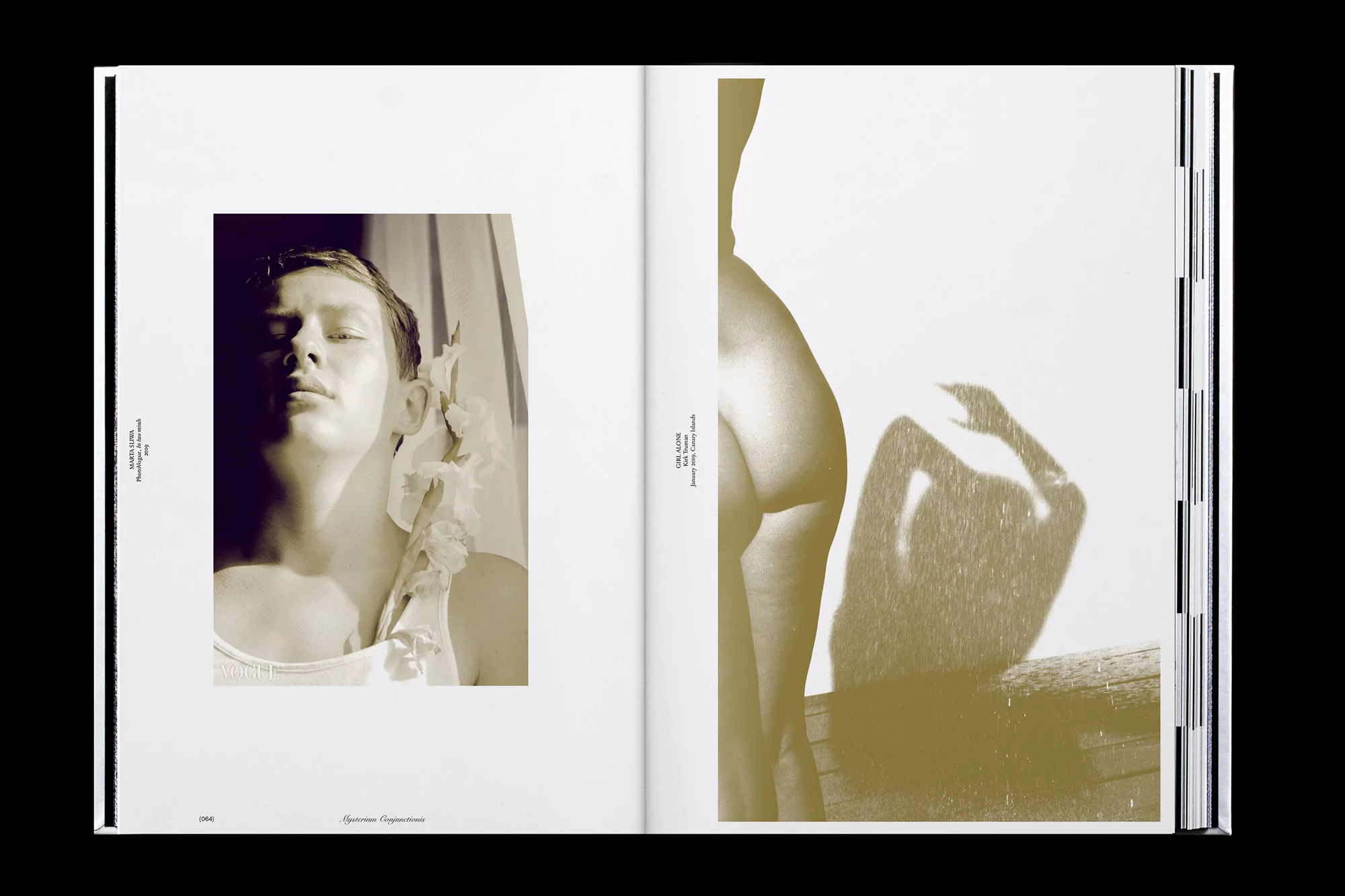 Monochromatic book spread featuring portraits of a woman and a body silhouette against a white backdrop with black text on the pages.