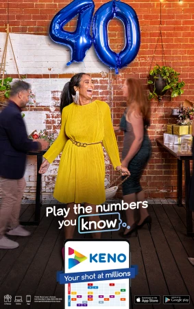A woman in a yellow dress celebrates with party guests and balloon decorations. There is a mobile game advertisement in the foreground.