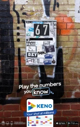 Number 67 displayed on a sticker-covered wall-mounted box against an aged red brick wall with overlaid promotional text.