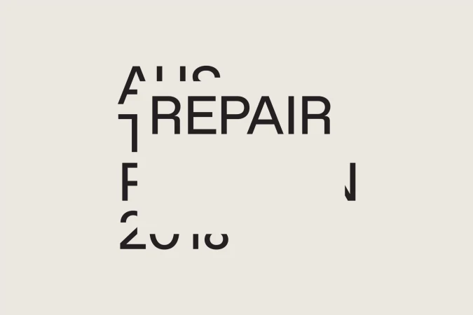 Abstract graphic design featuring the word 'REPAIR' among scattered letters and numbers on a pale background, presented in a minimalist style.