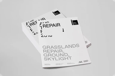 Stack of white brochures with bold black and grey typography for Australian Pavilion brand identity by Studio Round