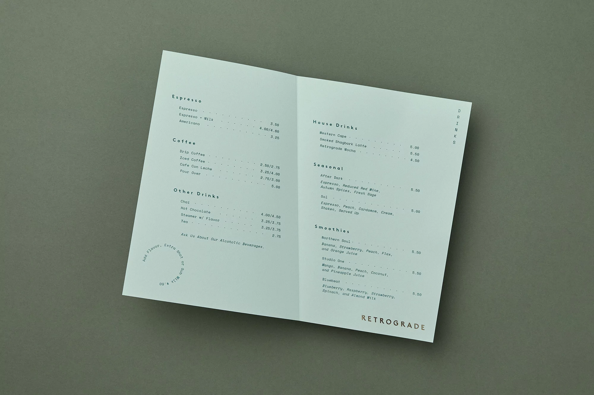 Open, white cafe menu featuring espresso, coffee, house drinks, seasonal drinks, and smoothies sits on a flat, neutral surface.