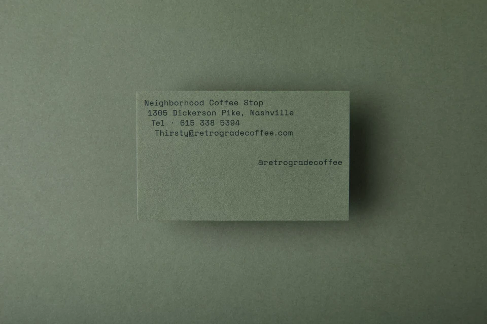 Business card for Neighborhood Coffee Stop, 1305 Dickerson Pike, Nashville. Contact details and social media handle included.