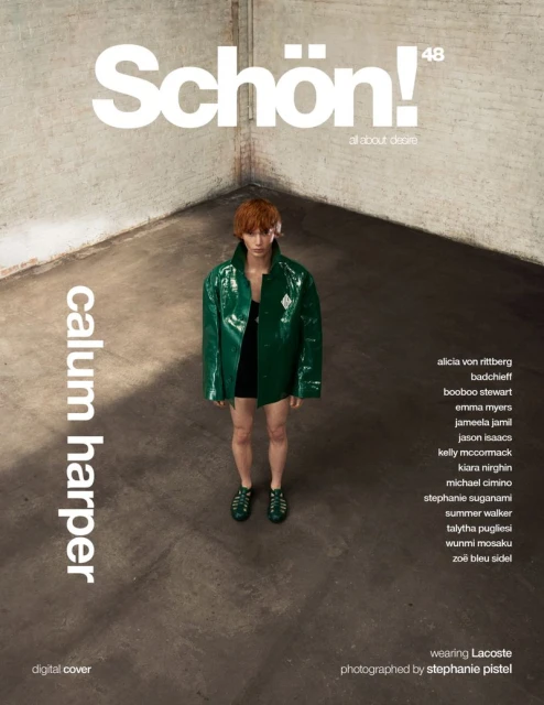 Schön! magazine cover featuring Calum Harper wearing a green, shiny Lacoste jacket, black top and green shoes in a bare corner studio.