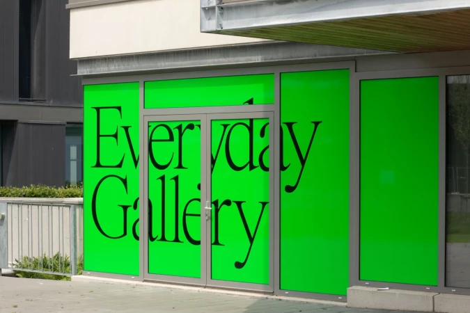 Exterior view of a building with green-painted windows displaying the text 'Everyday Gallery' in large black lettering.
