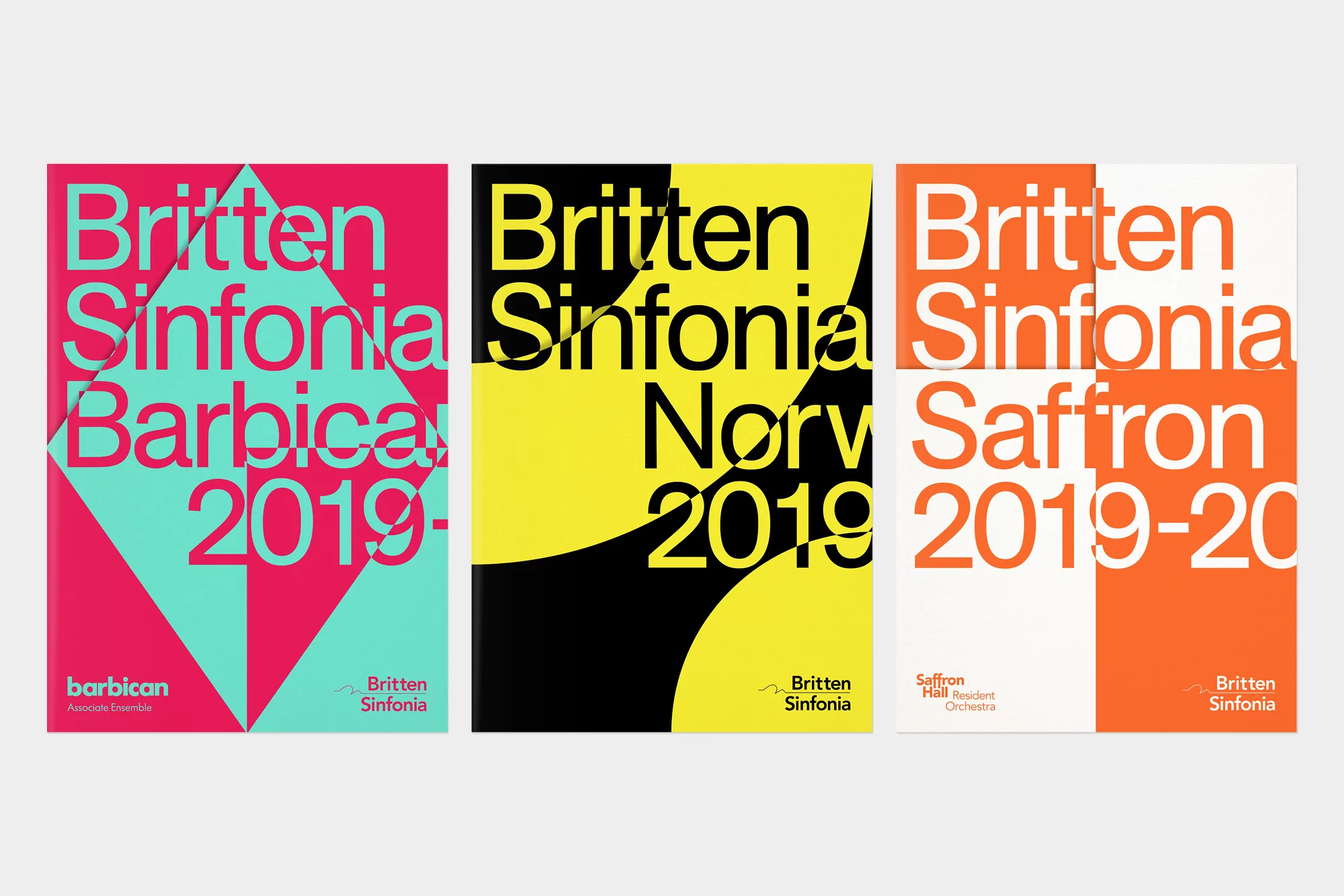 Three Britten Sinfonia posters in pink/teal, yellow/black, and orange/white, featuring bold typography and minimalist design, set against a white backdrop.