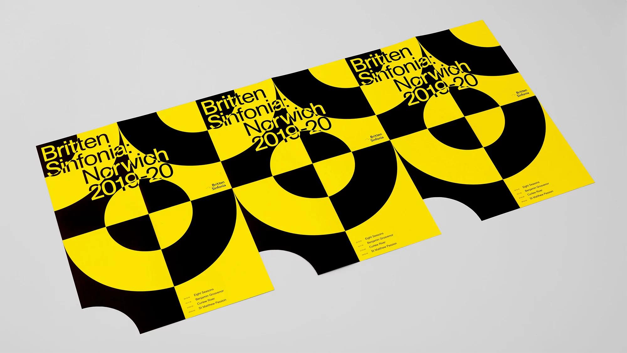 Three identical posters for the Britten Sinfonia Norwich 2019-20 season, featuring a yellow and black target-like graphic design.