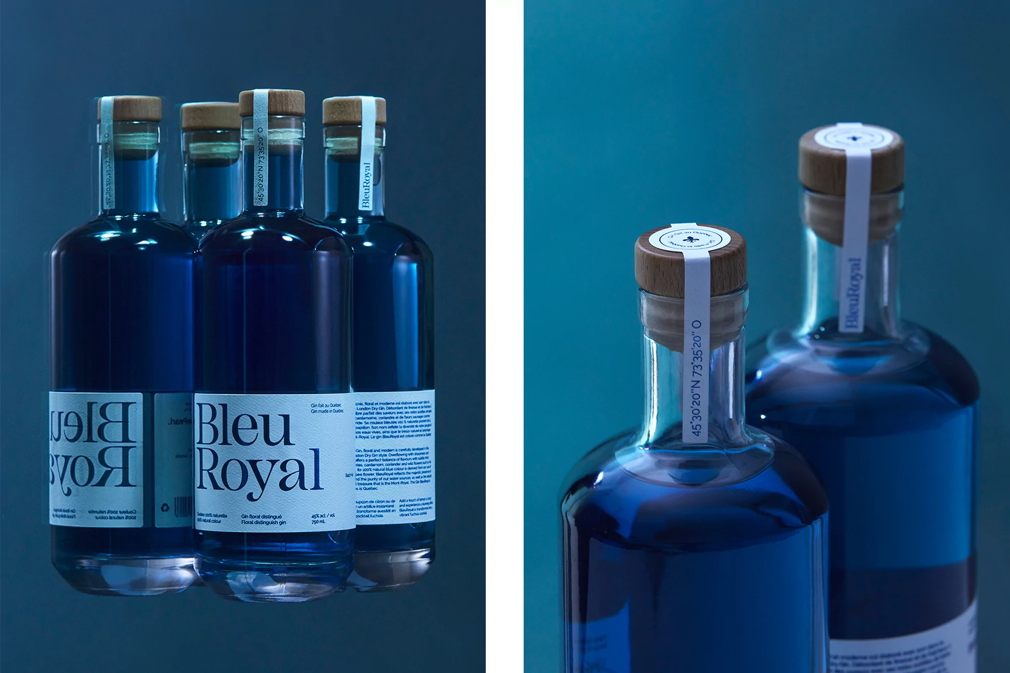 Several blue glass bottles of Bleu Royal gin with wood stoppers are lined up against a graduated blue background in a studio shot.