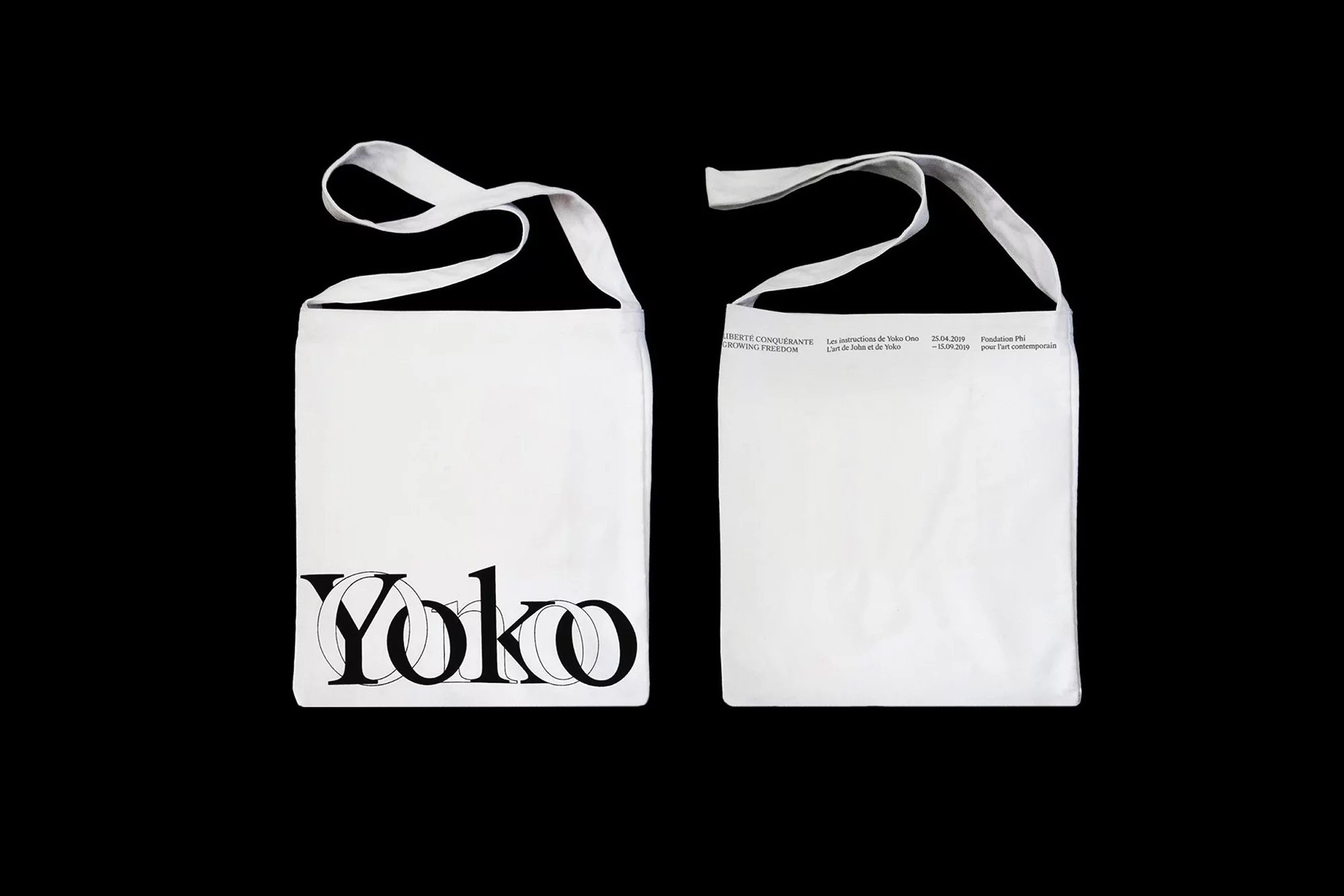 Two views of a white canvas tote bag featuring black typography and interlocking circles on a solid black background.