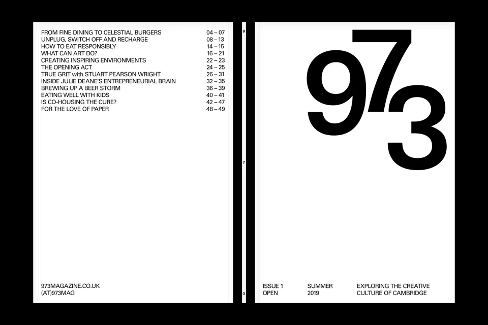 Magazine cover design featuring large, stylized numbers '973' in bold black font, with minimalist layout and text details on a white background.