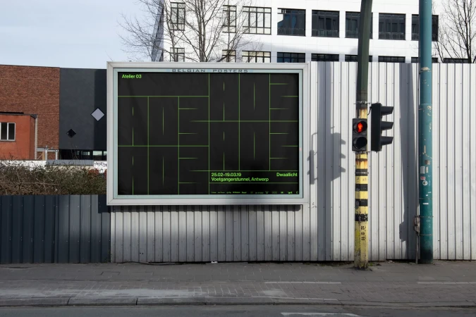 Outdoor advertising billboard featuring minimalist green-line art on a black background, placed on a gray fence along an urban street with a traffic light.