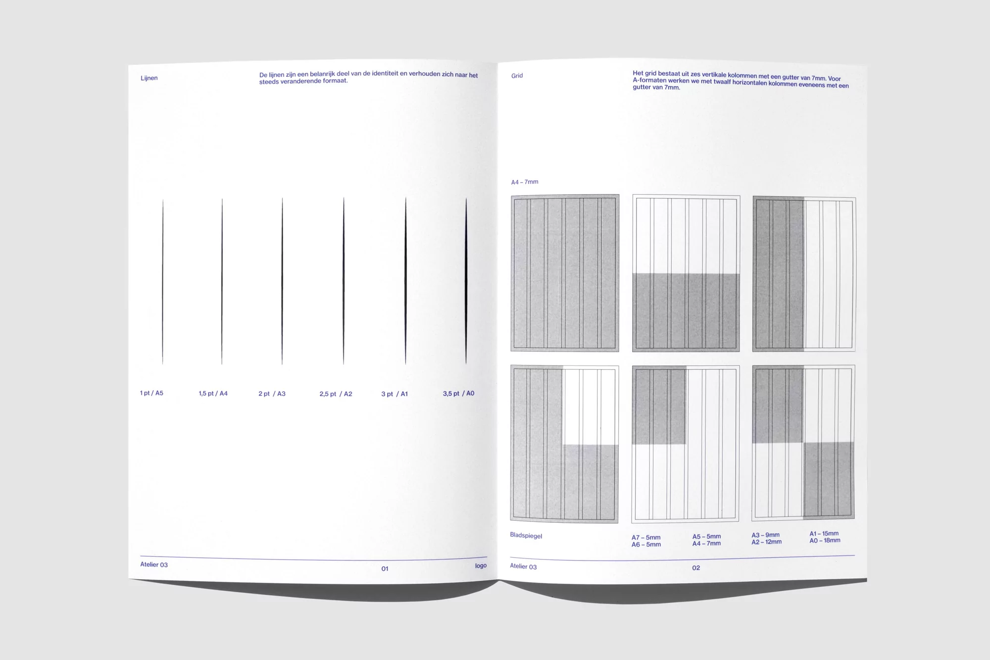 Open book spread with graphic design layouts featuring vertical lines and rectangular grids against a pale background.
