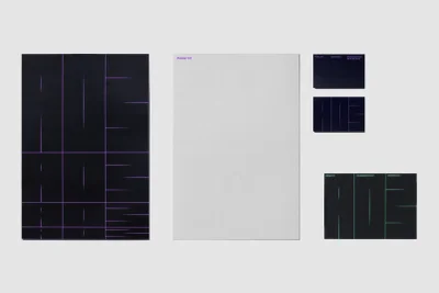 Graphic design brand identity presentation featuring posters and business cards with purple typography on dark and light paper.