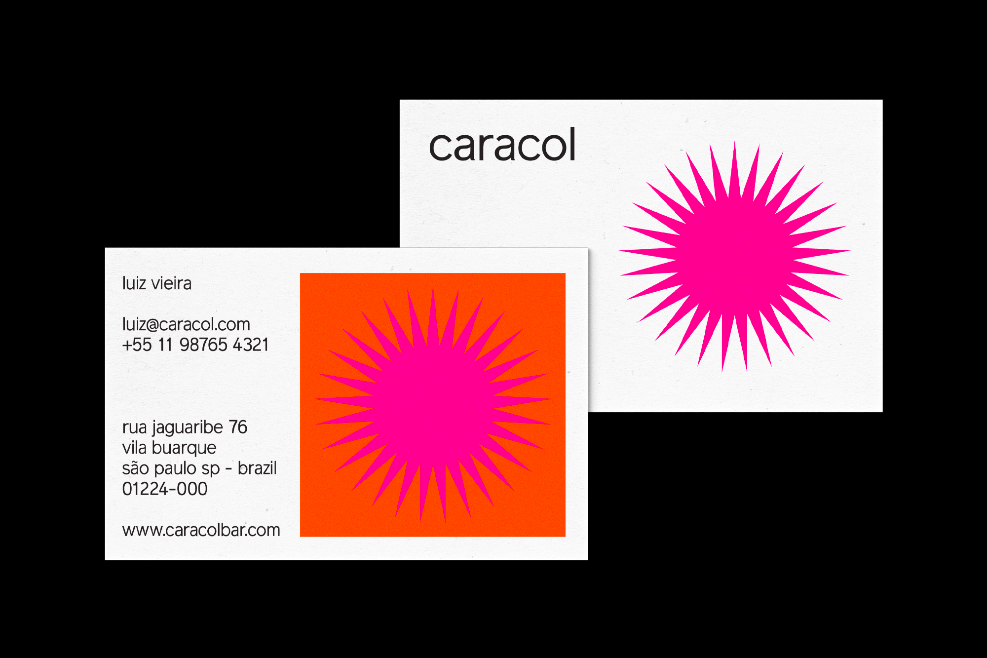 Graphic design featuring two white business cards with a vibrant pink sunburst design against a stark black background.