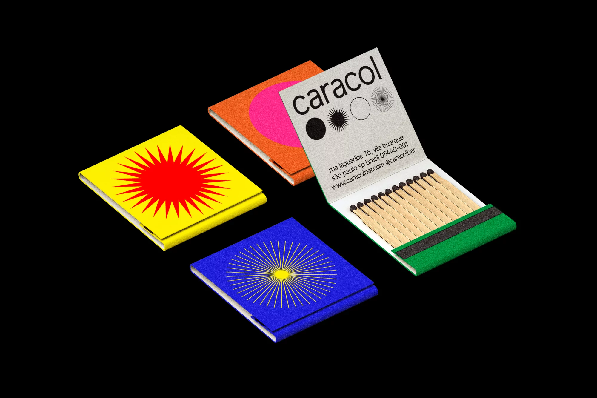 Four colorful matchbooks displayed on a black surface. One matchbook is opened to show matches, with text and logos visible.