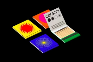 Four colorful branded matchbooks arranged diagonally on a solid black background by Caracol.