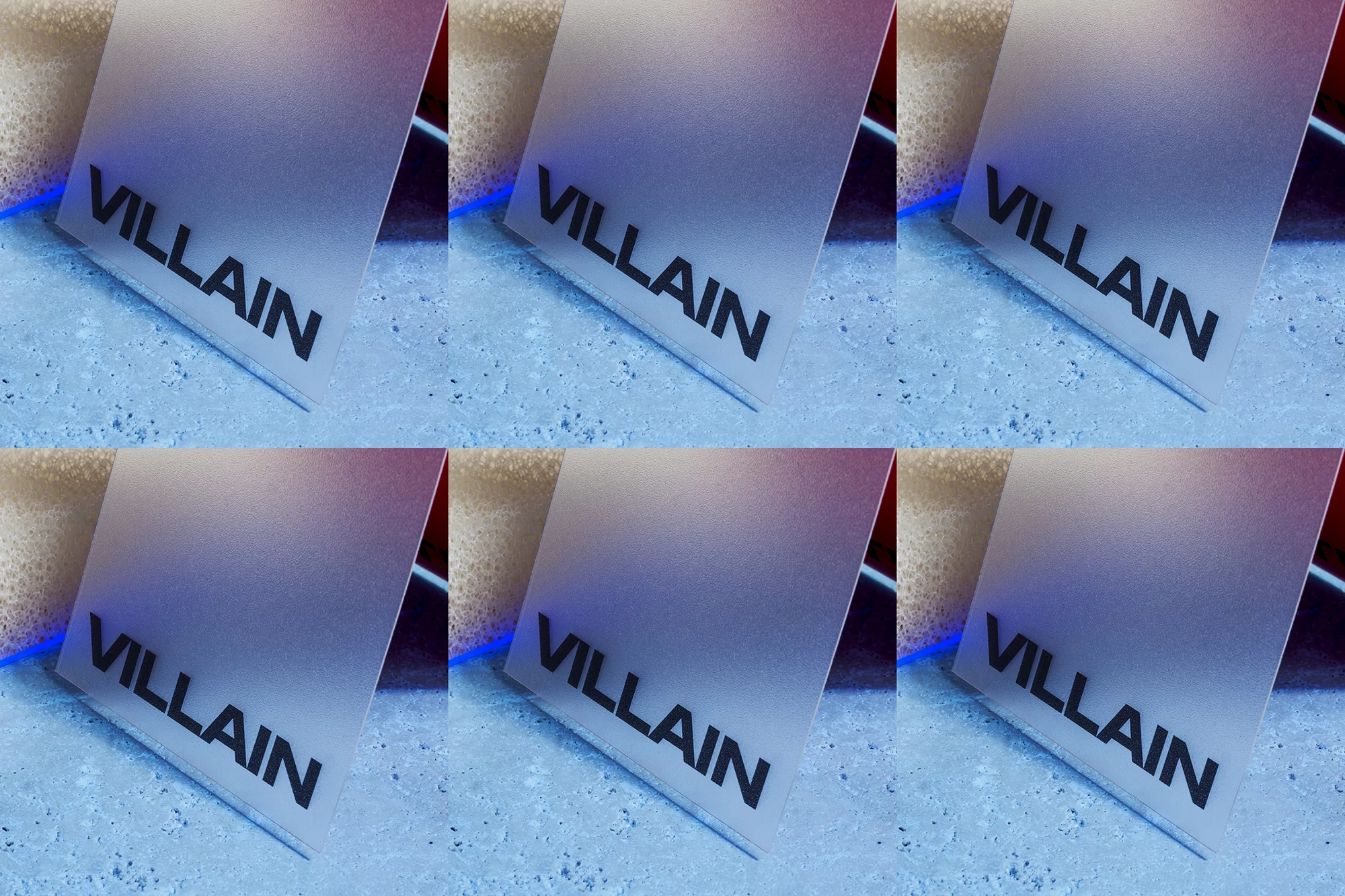Multiple business cards with the word VILLAIN in black font, arranged in a grid, featuring a frosted or textured surface.