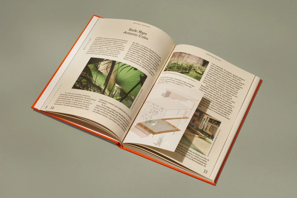 Open book featuring lush garden designs and architectural drawings, offering a glimpse into landscape architecture and design.