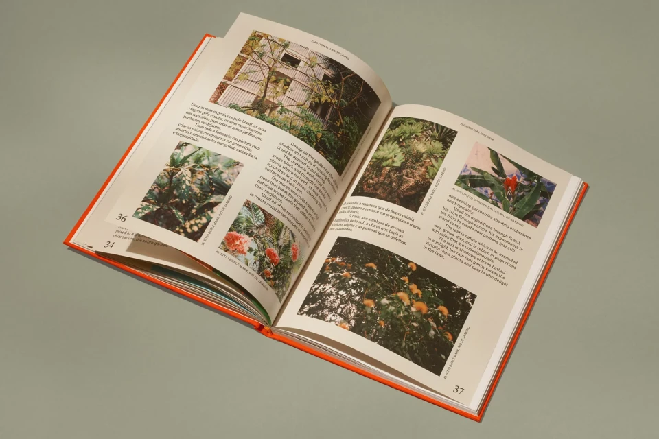 Open book displays lush tropical foliage, featuring close-up photographs of exotic plants with descriptive text on a light gray background.