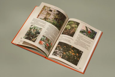 An open hardcover book displaying full-color landscape photographs and descriptive text blocks on two facing pages.