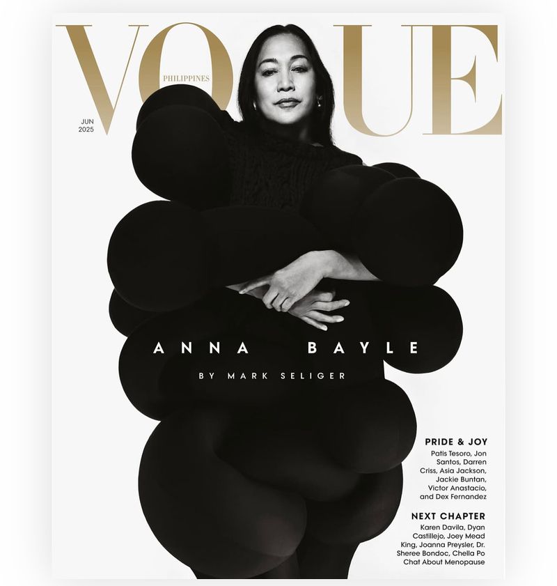 Vogue Philippines cover featuring Anna Bayle in a dark, dramatic dress against a clean white backdrop, showcasing fashion and portraiture.