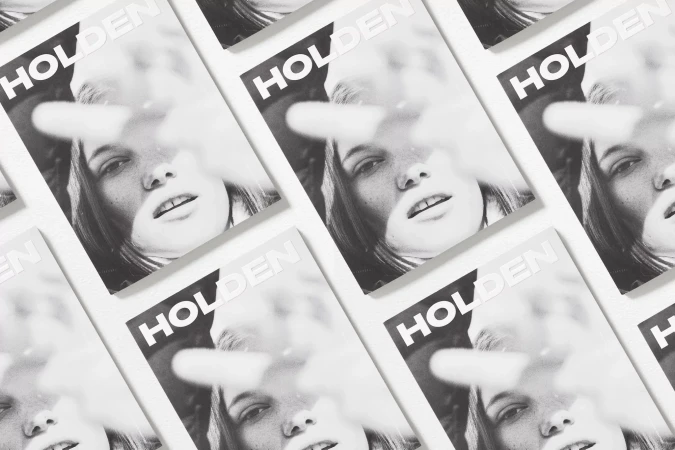 Multiple magazine covers featuring a black-and-white portrait of a young woman partially obscured by bright, diffused light.