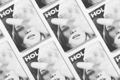 Repeated print covers featuring the Holden brand identity and a black and white portrait of a person