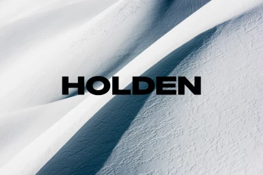 Holden brand identity typography overlaid on a snowfield landscape with diagonal shadows
