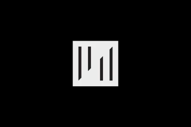 Minimalist white graphic logo design featuring vertical slashes inside a square on a black background