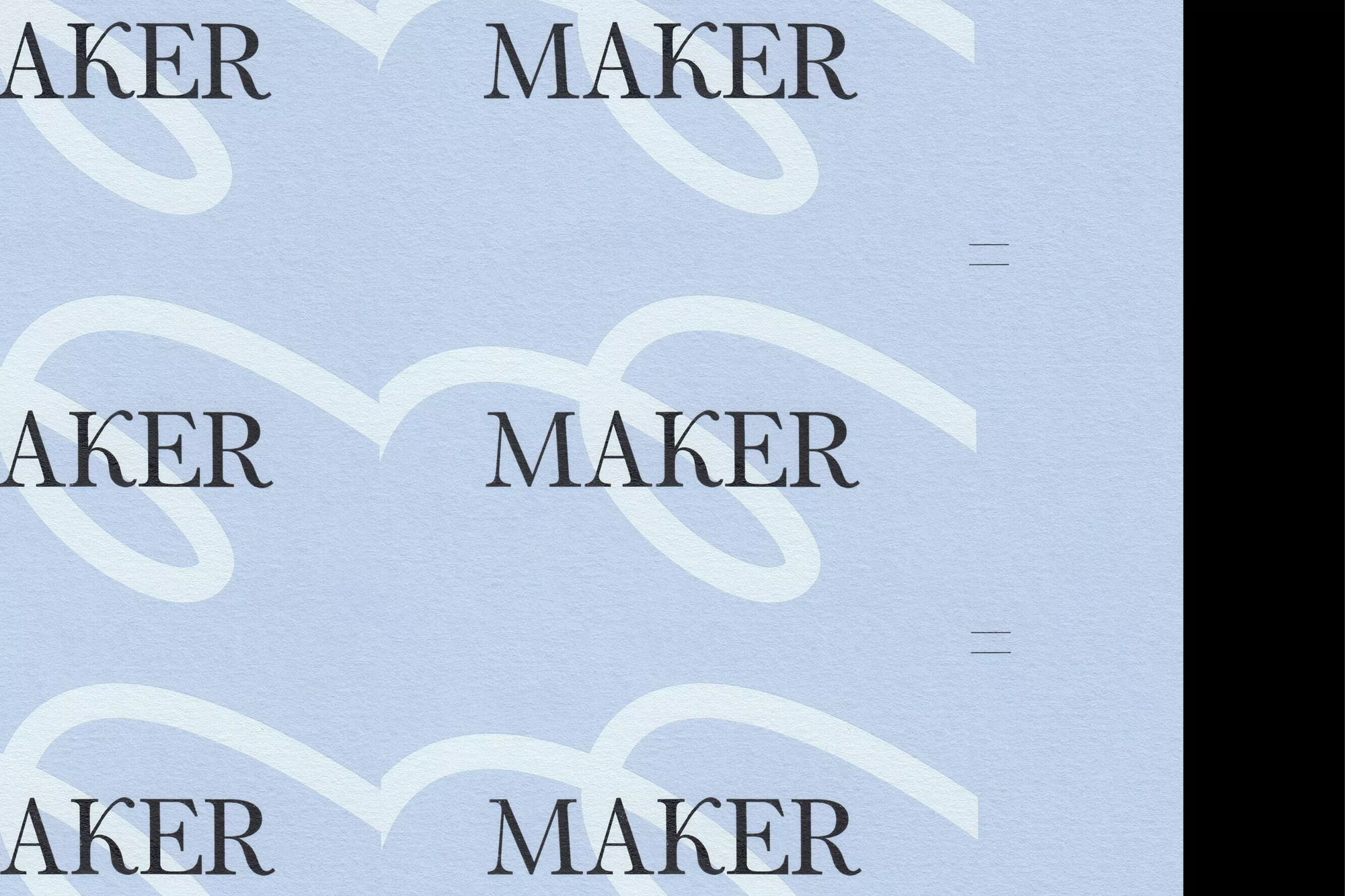 Close-up shot of the word 'MAKER' printed multiple times in a repetitive pattern on light blue paper, design with text.