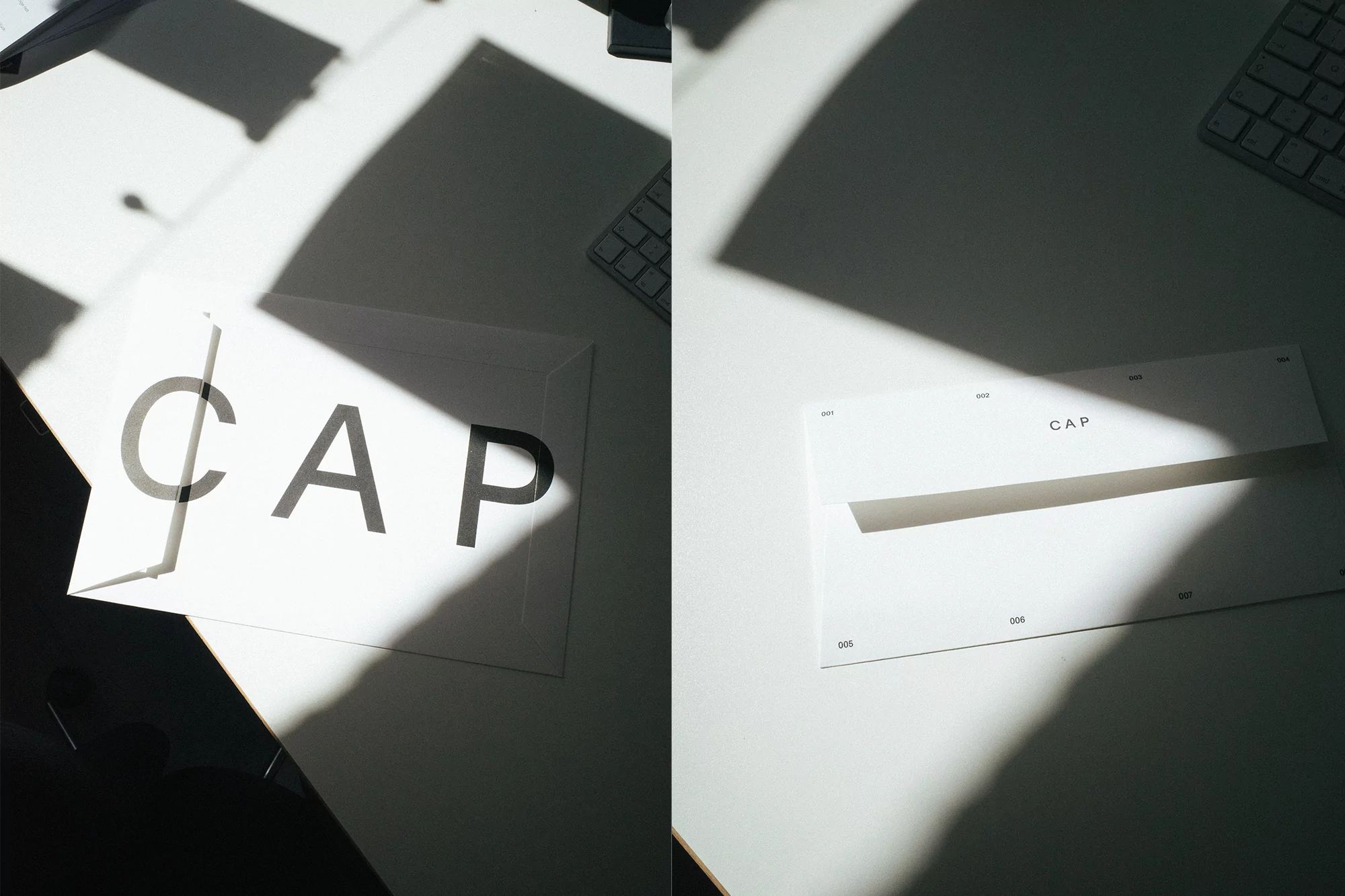 Two compositions show white envelopes with 'CAP' text on white surfaces, creatively lit with shadows and a visible computer keyboard.