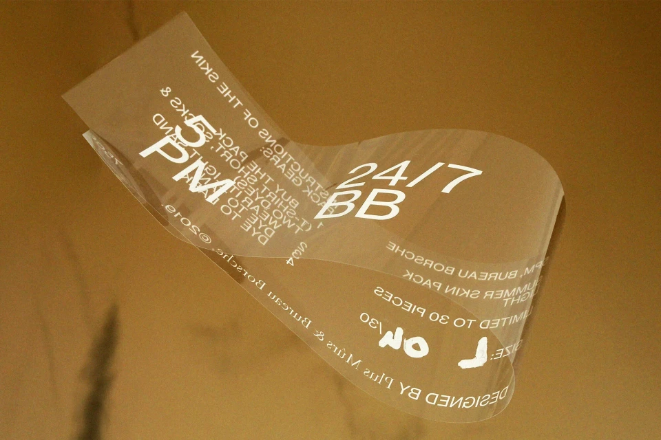 Clear wrapping with text on a gold background. Product package with instructions for skin application. Beauty and personal care theme.