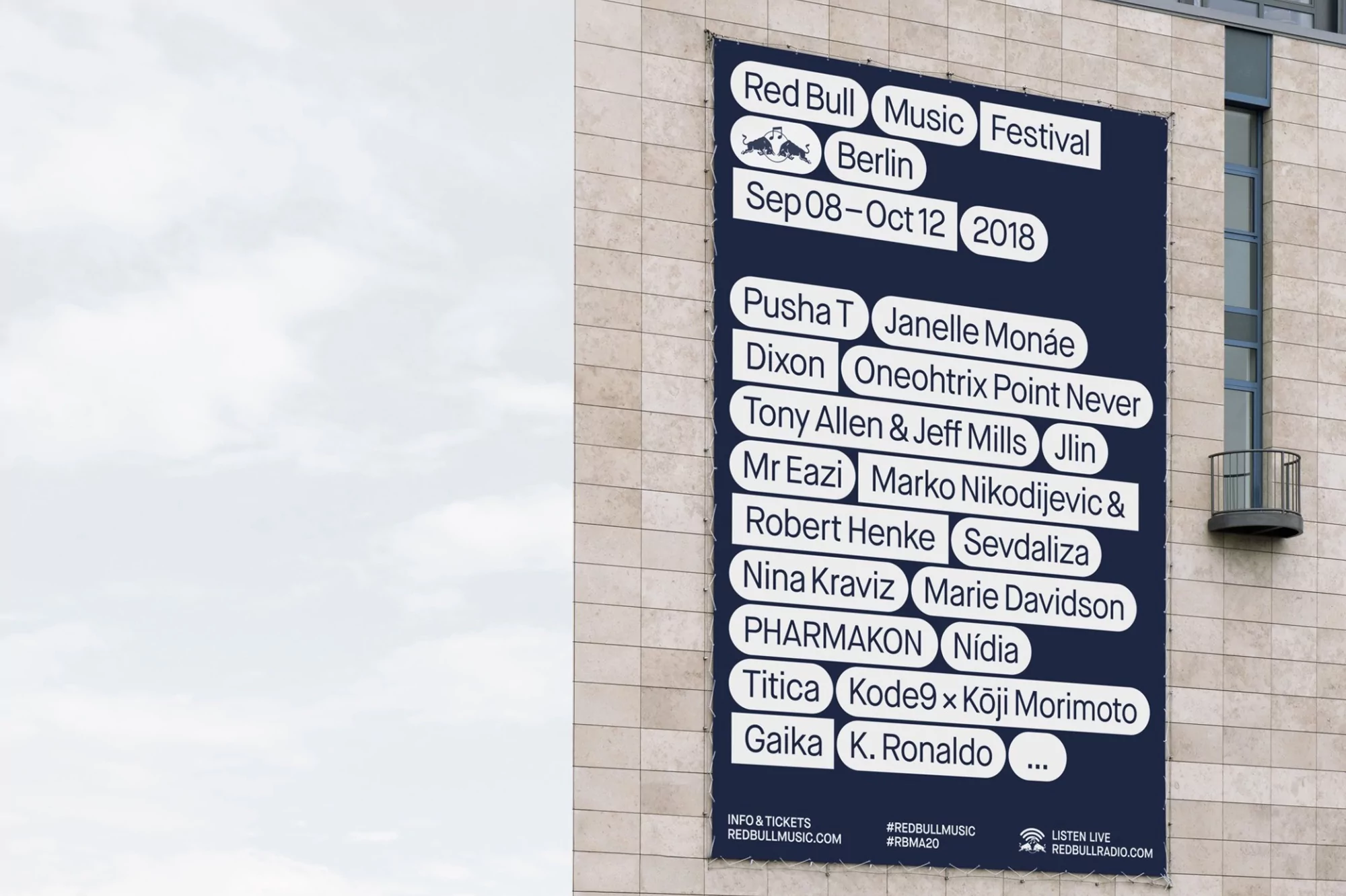 Promotional banner for the Red Bull Music Festival Berlin 2018, listing performers, against a building facade under cloudy sky.