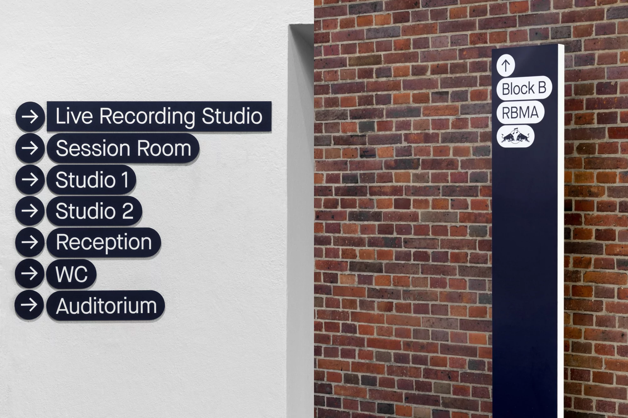 Indoor directional signs on a white wall pointing to spaces like the live recording studio, reception, and auditorium in a music complex.