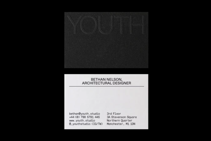 Close-up of a black card embossed with the word 'YOUTH' above a white business card for Bethan Nelson, Architectural Designer.