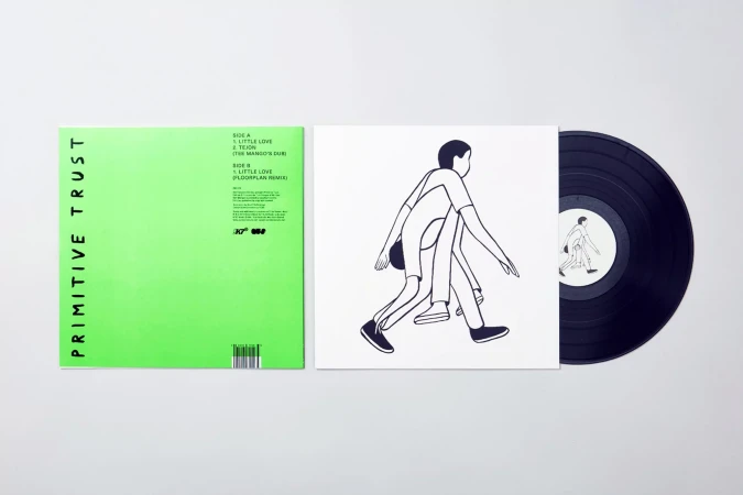 Vinyl record featuring a green album cover with 'Primitive Trust' text and a white cover with abstract human figures.