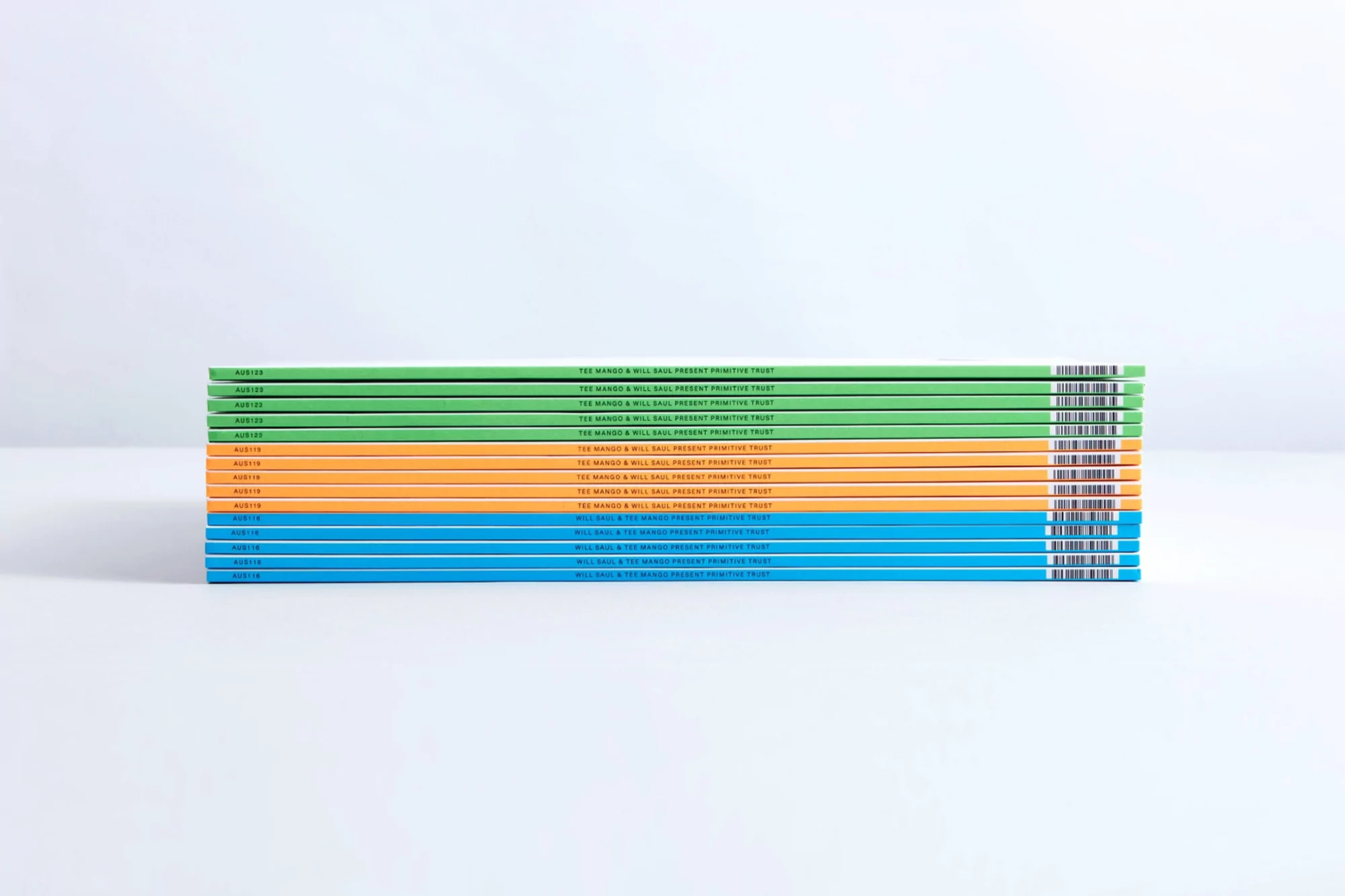 Stack of colorful bound documents with printed text on a white surface, studio lighting, minimalist presentation, and clean aesthetic.